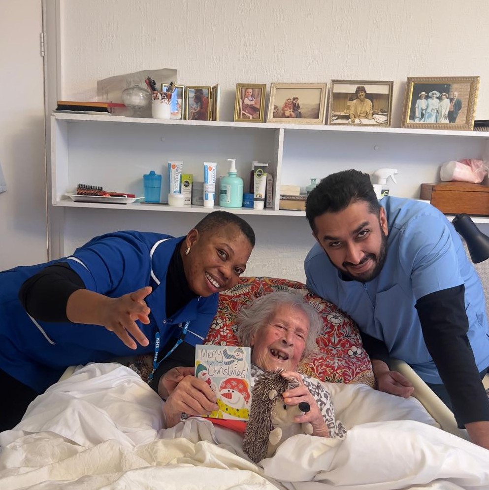 Brancaster Homecare carers celebrating Christmas with a client